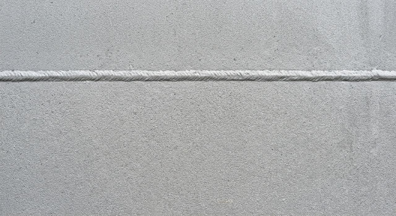 Steel plate and weld seam blasted back to clean, profiled metal