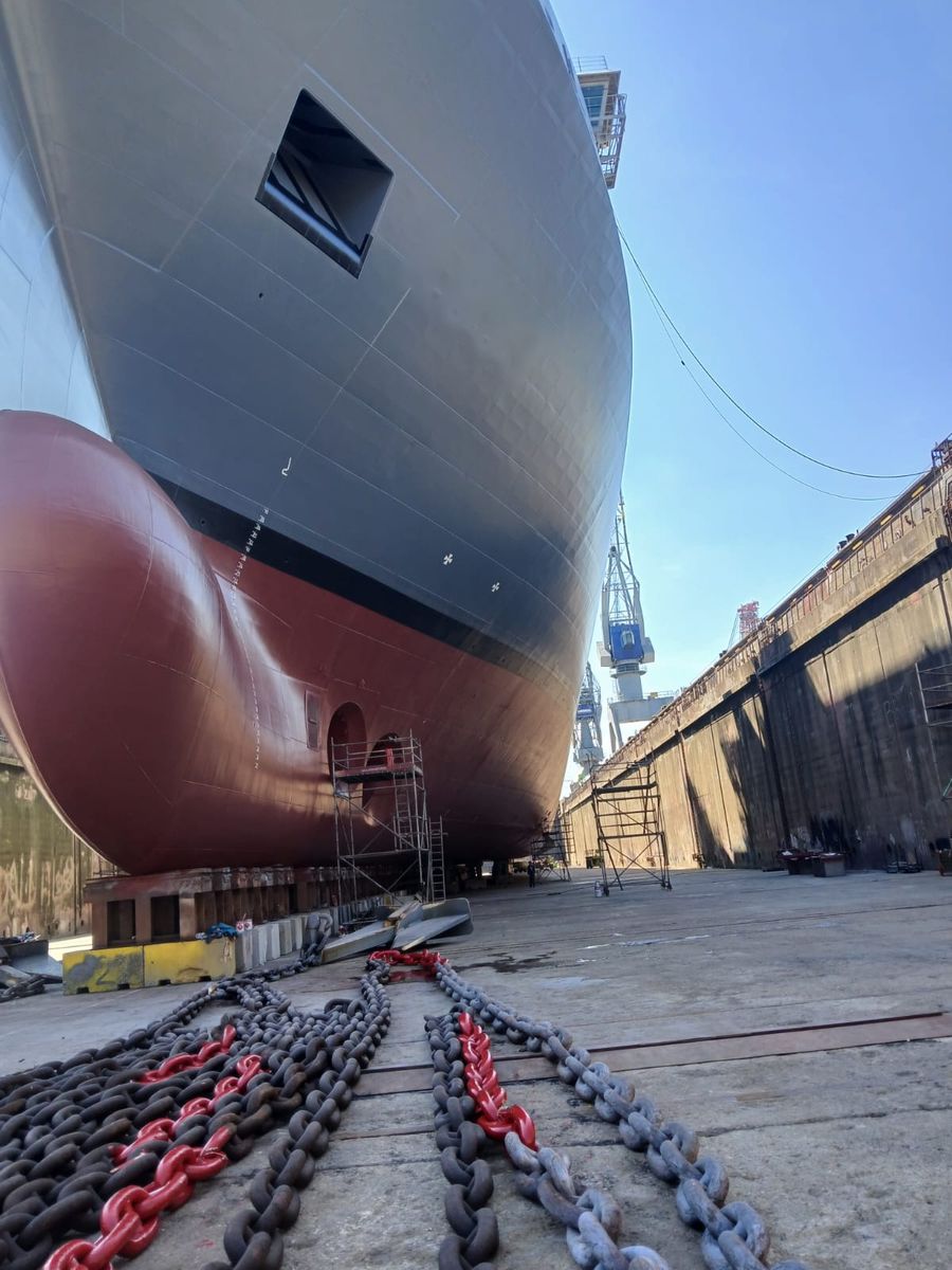 Low angle view of the bow and bulbous bow with staging alongside